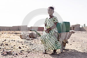 Young African Woman Gathering Fresh Water in a rural village