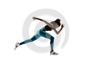 Young african woman running or jogging isolated on white studio background.