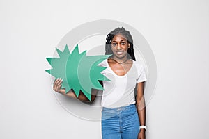 Young african woman screaming in blank speech bubble isolated on black background