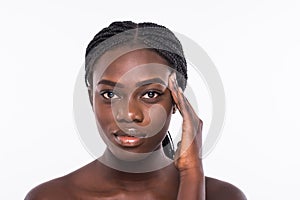 Young african woman touching her face isolated on white background