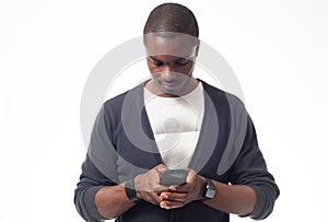 Young afro-american man looking his mobile phone