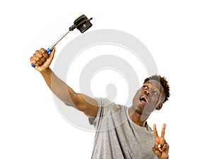 Young afro american man smiling happy taking selfie self portrait picture with mobile phone