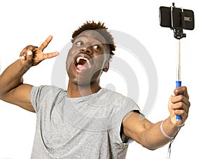 Young afro american man smiling happy taking selfie self portrait picture with mobile phone