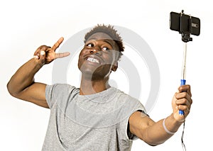 Young afro american man smiling happy taking selfie self portrait picture with mobile phone