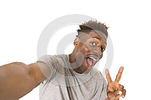 Young afro american man smiling happy taking selfie self portrait picture with mobile phone