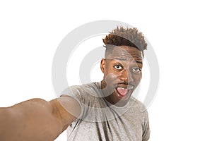 Young afro american man smiling happy taking selfie self portrait picture with mobile phone
