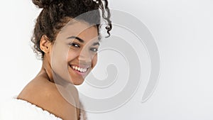 Young afro american woman smiling wide, looking at camera