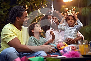 Young  afro family cuddling and smiling  at home. Enjoying and having fun together