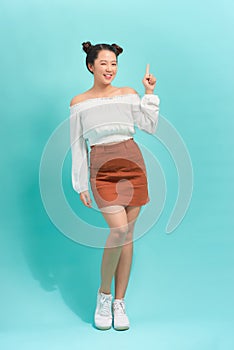 Young aisan woman with finger point up