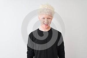 Young albino blond man wearing black t-shirt standing over isolated white background with a happy and cool smile on face