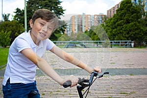 A young American boy child riding bicycle