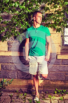 Young American Man traveling, relaxing at park in New York in summer