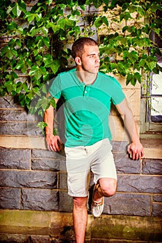 Young American Man traveling, relaxing at park in New York in summer