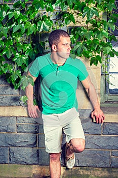 Young American Man traveling, relaxing at park in New York in summer