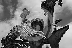 Young angels standing by the crosses photo