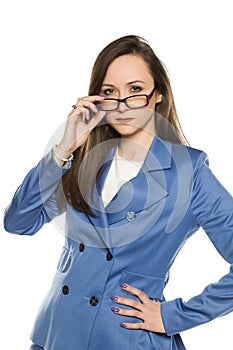 Young angry business woman with glasses