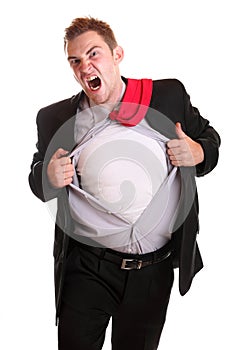 Young angry businessman tearing his shirt