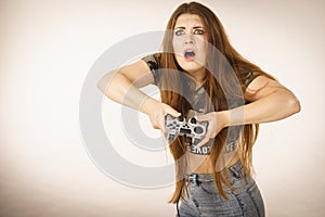 Angry woman holding gaming pad