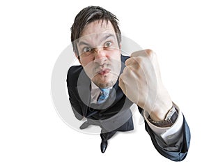 Young angry manager is threatening with fist. Isolated on white background. View from top