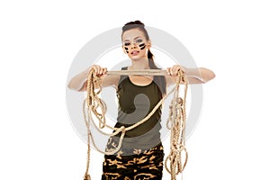 Young angry soldier woman tugging a rope photo