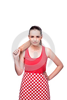 The young angry woman with rolling pin isolated on white