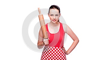 The young angry woman with rolling pin isolated on white