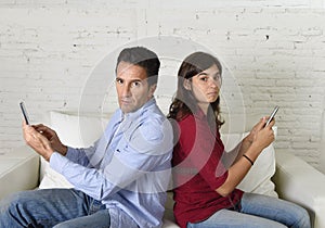 Young antisocial mobie phonel addict couple ignoring each other using internet compulsively