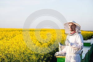 Young apiarist gesturing thumb up