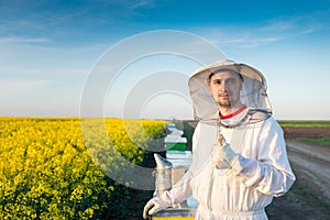 Young apiarist gesturing thumb up