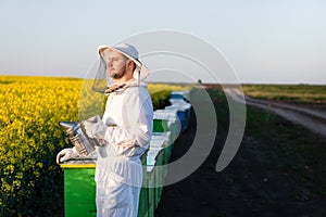 Young apiarist looking at the Sun