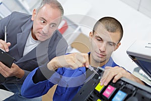 Young apprentice doing repair