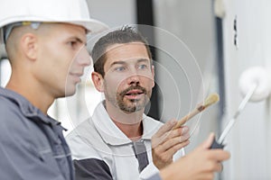 Young apprentice painter in professional training