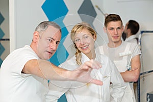 Young apprentice painter in professional training