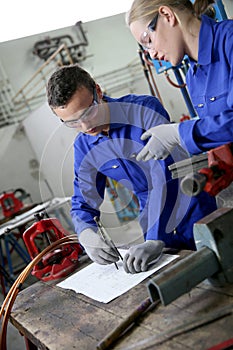 Young apprentice in plumbery working