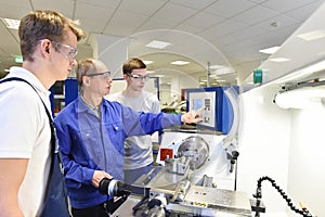 Young apprentices in technical vocational training are taught by