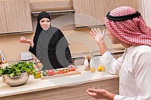 The young arab family in the kitchen