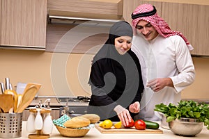 The young arab family in the kitchen