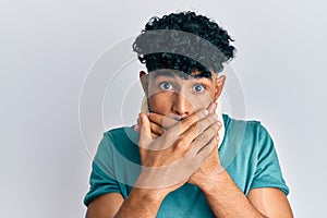 Young arab handsome man wearing cervical neck collar shocked covering mouth with hands for mistake