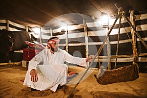 Young arab man in his house