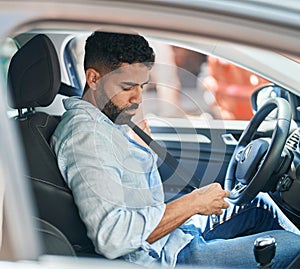 Young arab man wearing car belt at street