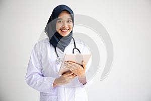 Young Arab Muslim intern doctor women smile on isolate white background concept for Islam people working in medical hospital healt photo