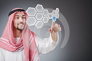 Young arab pressing virtual buttons