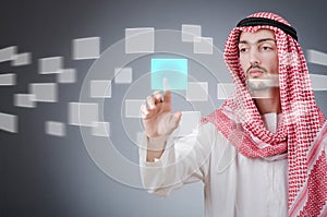 Young arab pressing virtual buttons