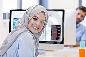 Young Arabic business woman wearing hijab,working in her startup