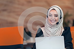 Young Arabic business woman wearing hijab,working in her startup office.