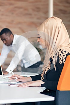 Young Arabic business woman wearing hijab,working in her startup office.