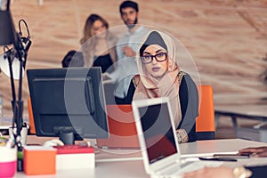 Young Arabic business woman wearing hijab,working in her startup office.