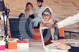 Young Arabic business woman wearing hijab,working in her startup office.