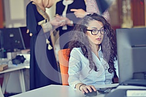 Young Arabic business woman wearing hijab,working in her startup office. Diversity, multiracial concept