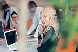 Young Arabic business woman wearing hijab,working in her startup office.